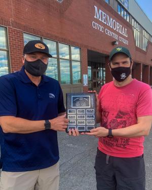 Denis Boudreau receiving the 2020-21 RNMHA Coach of the year award from Association President René Haché